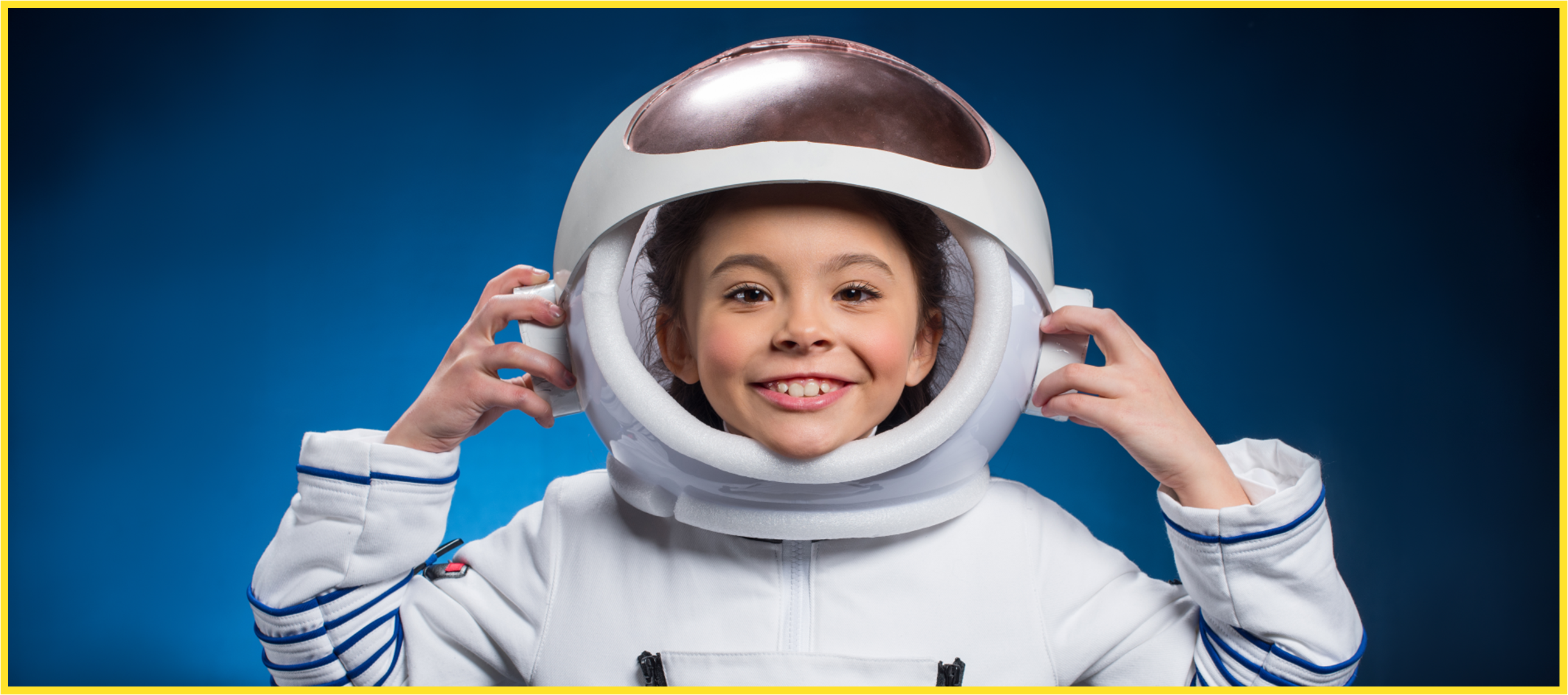 Kid smiling wearing an astronaut suit