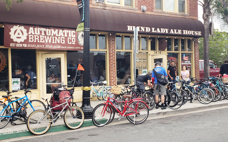 Bikes parked in front of businesses