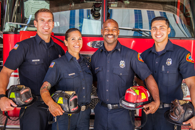 Photo of firefighters in front of a firetruck