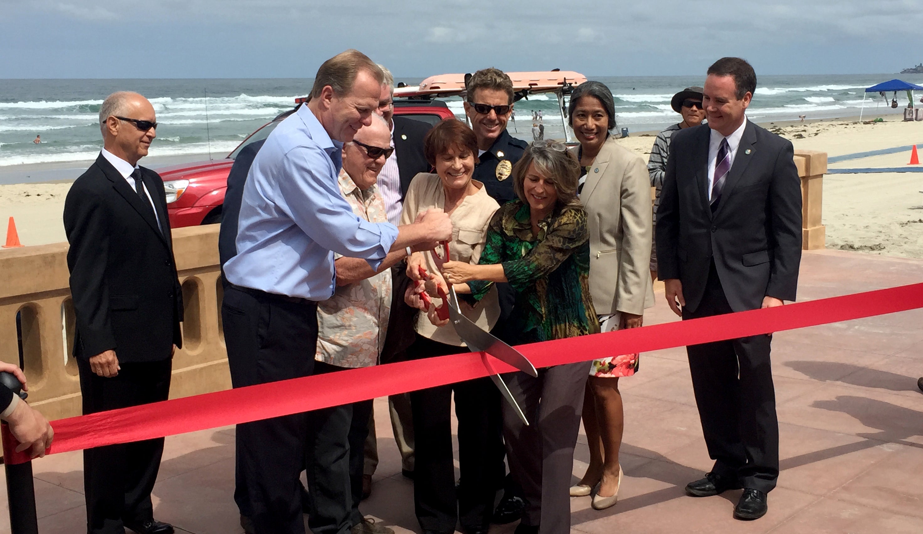 Mayor Kevin Faulconer, Councilmember Lorie Zapf and community leaders cut the ribbon on the reconstructed Mission Beach boardwalk.