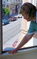 Photo of Woman Wet Dusting Window Sills