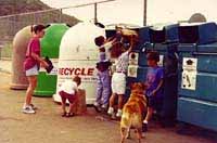 Photo of People Using Recycling Bins