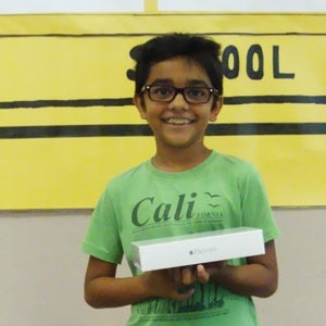 Photo of the Summer Reading Program raffle winner Hariom.