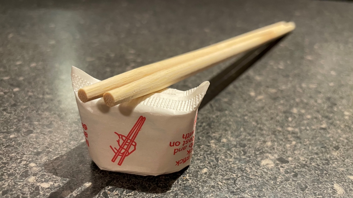 Chopsticks resting on a chopstick stand