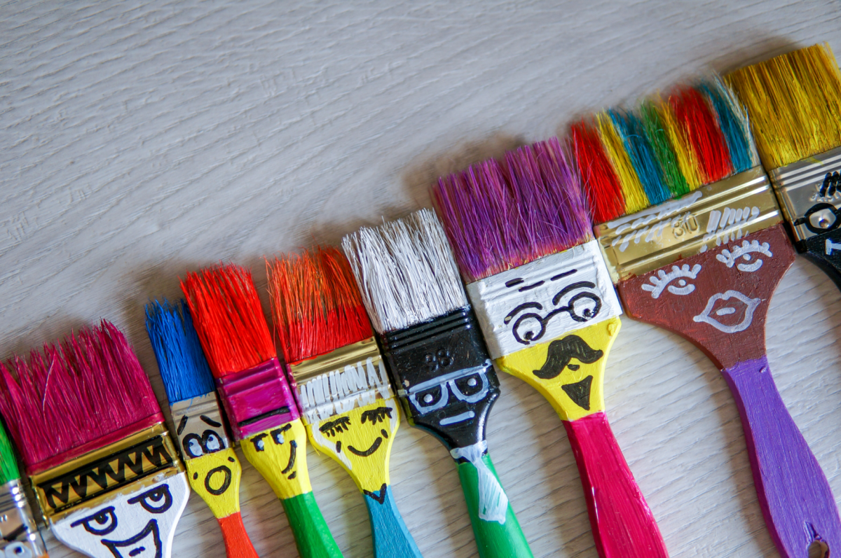 Paintbrushes with faces drawn on then