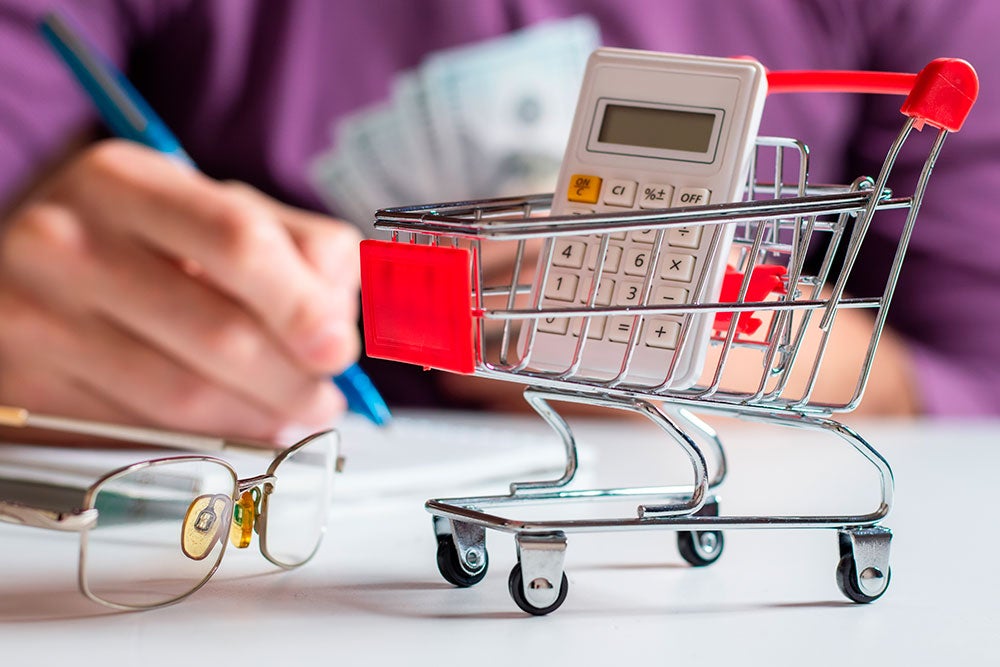 toy shopping cart containing calculator