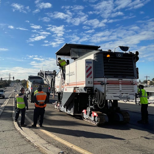 City workers fixing a road with slurry seal