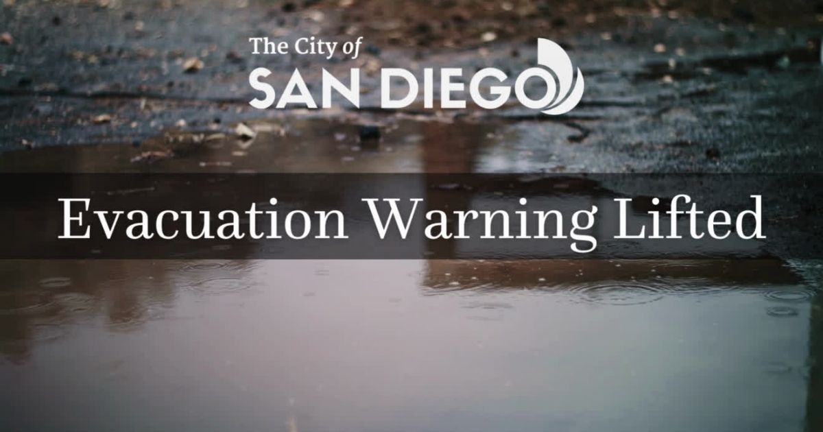 puddle of water with text over it with the city of san diego logo and Evacuation warning lifted