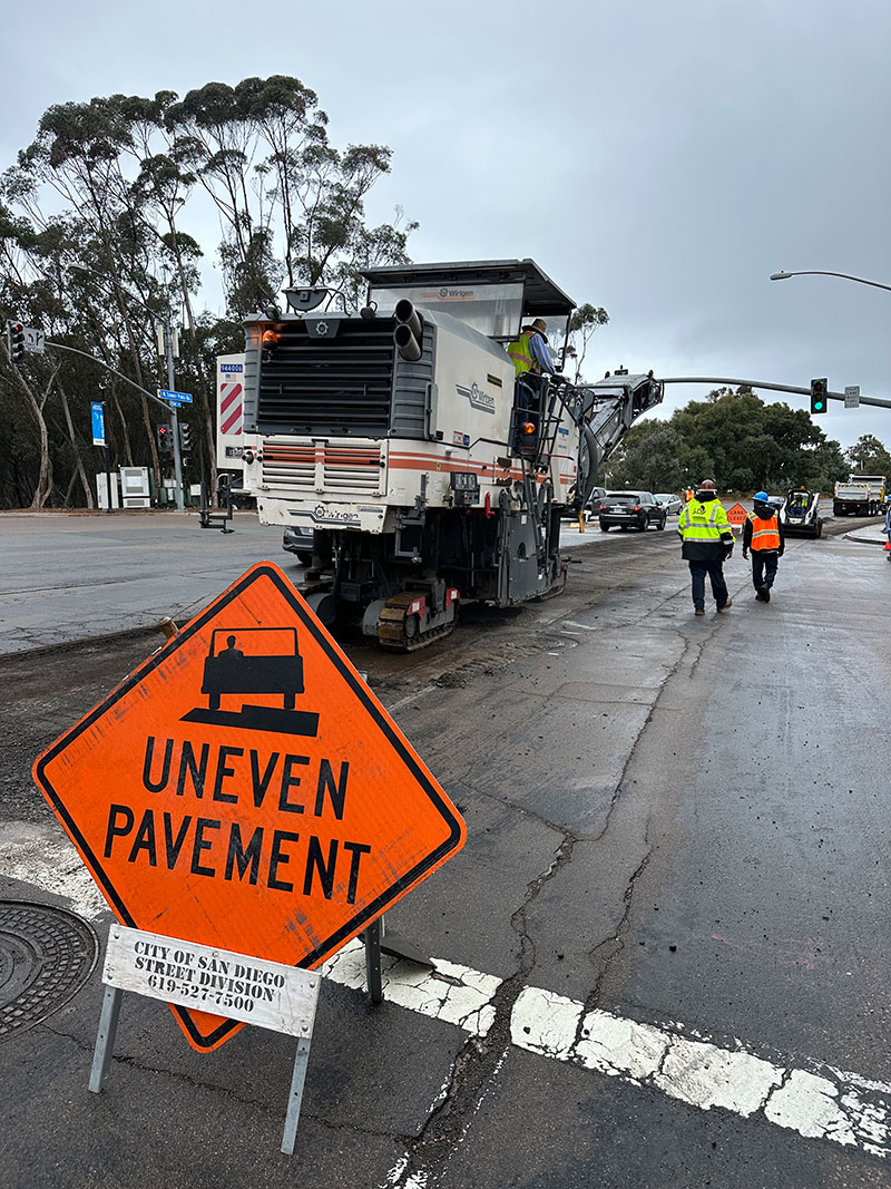 City workers repaving a cracked street
