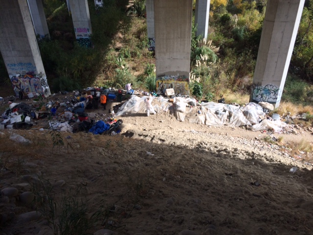 encampments located under a bridge along San Diego River