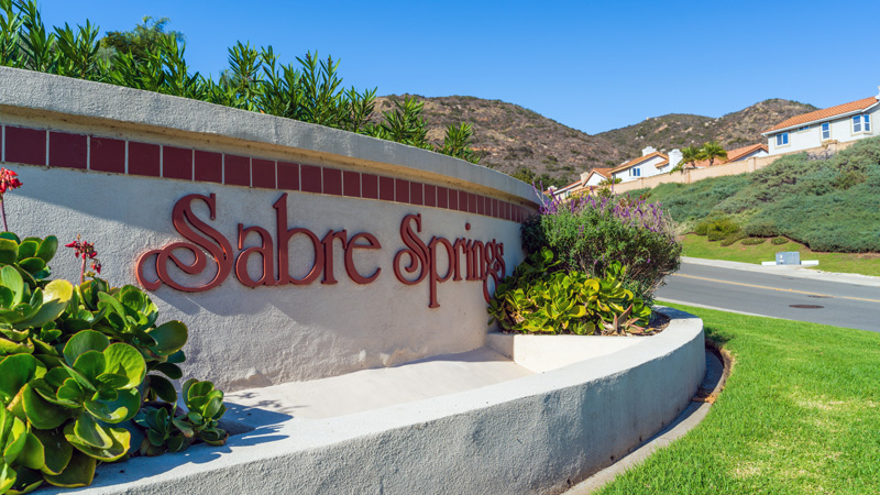 Sabre Springs entry sign with neighborhood in background