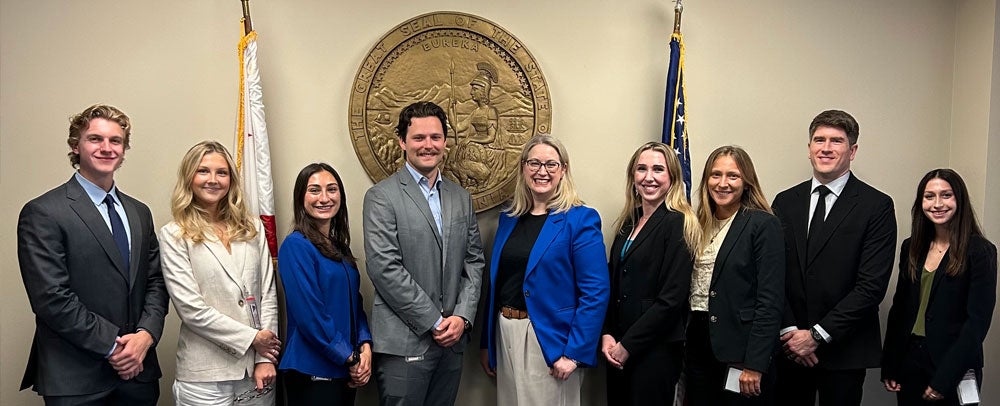 City Attorney Heather Ferbert in a group photo with interns