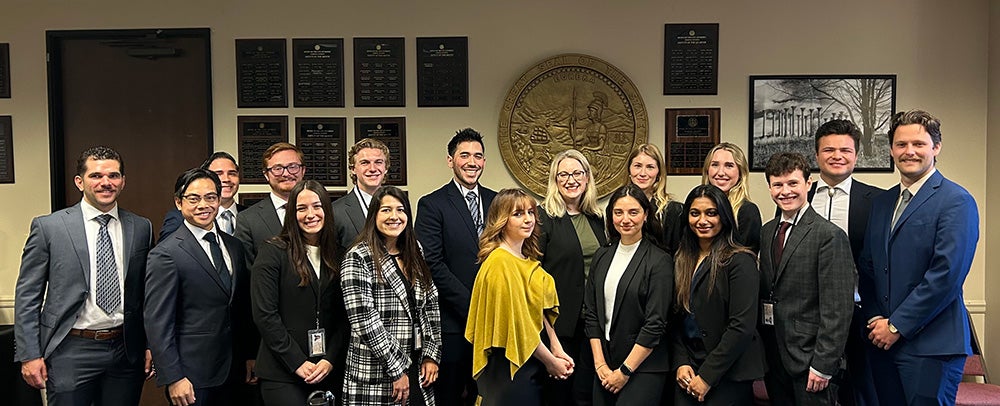 Group photo of City Attorney Heather Ferbert and interns