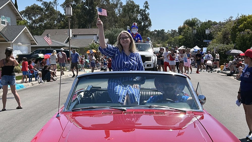 City Attorney Heather Ferbert rides in classic Mustang at the Scripps Ranch 4th of July Parade