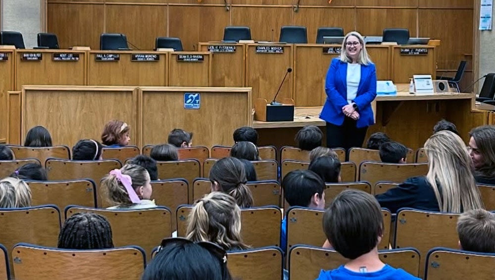 CIty Attorney Ferbert speaks to La Jolla Country Day students at City Hall