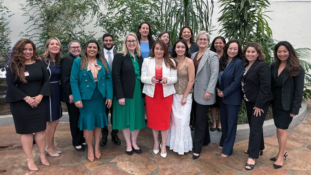 Office of the City Attorney Team celebrates Senior Chief Deputy City Attorney as she accepts award at SDCBA