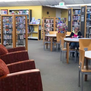 A patron seated at a table at Otay Mesa/Nestor Library
