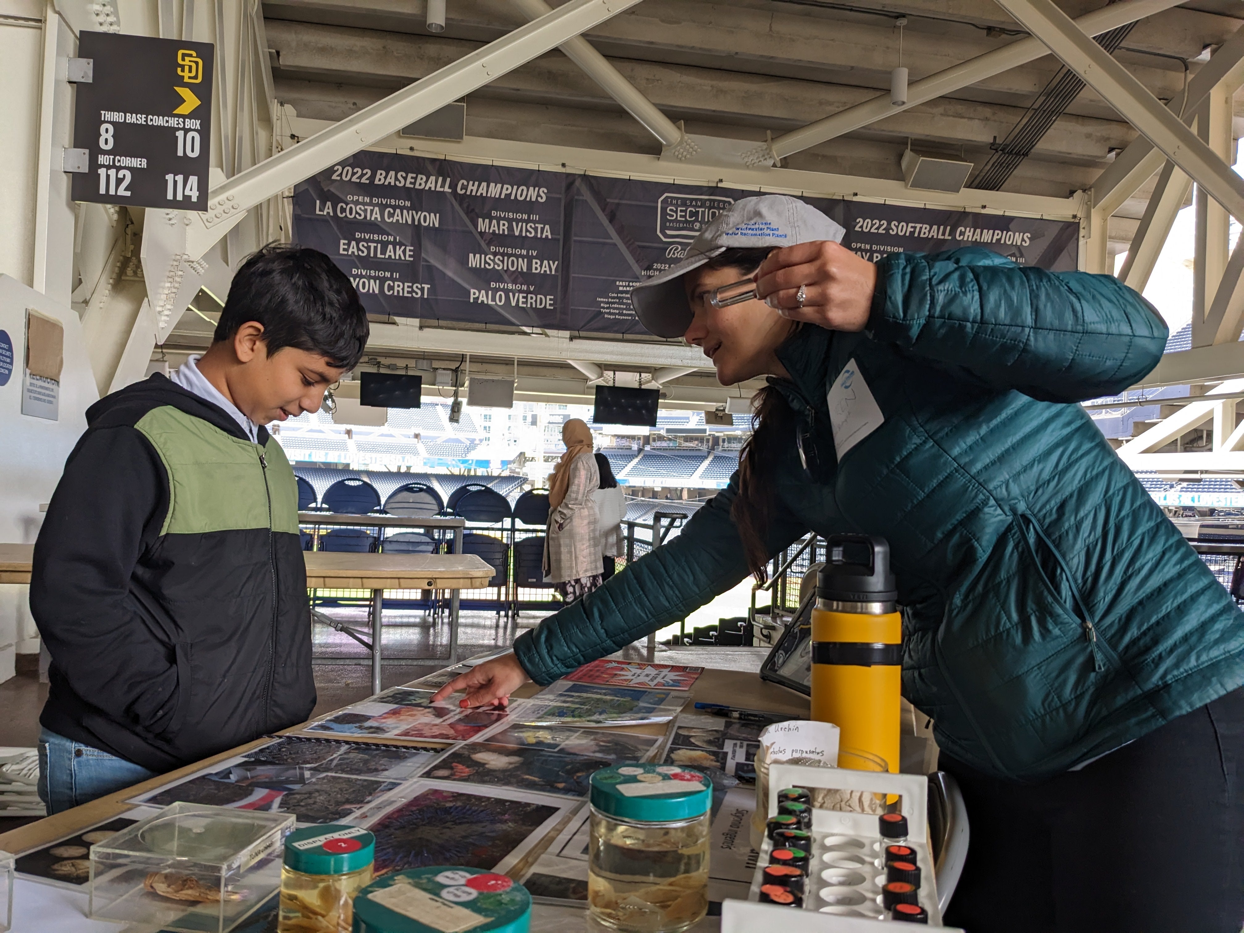A marine biologist shows common invertebrates found as part of the City's Ocean Monitoring Program.