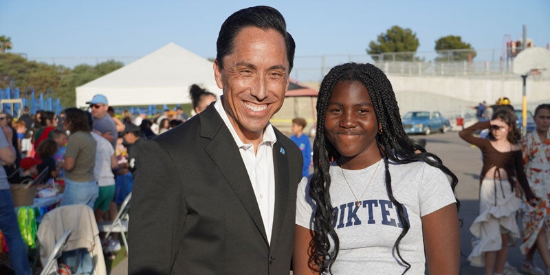 Mayor Todd Gloria with community member