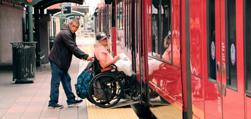 person in wheelchair boarding the trolley