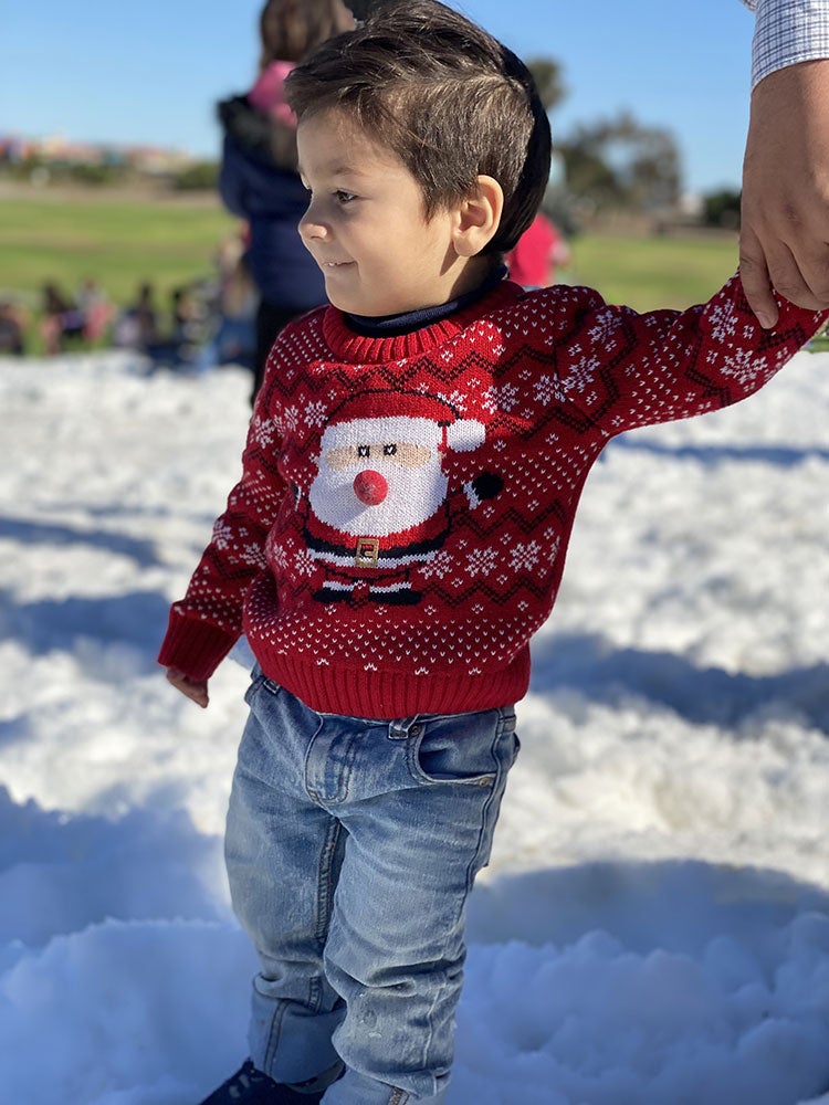 photo of little boy in the snow