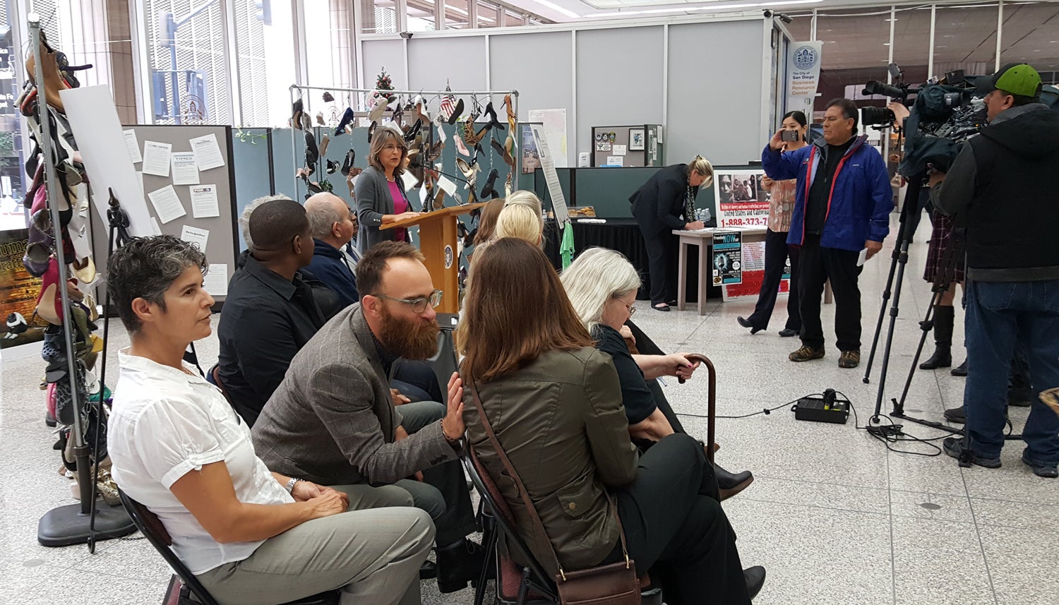 Photo of Councilmember Lorie Zapf speaking at the Out of the Shadows display at City Hall.