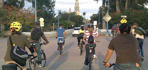 Bicyclists riding to Balboa Park