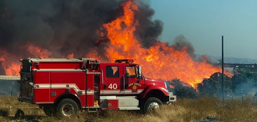 Fire truck next to a wildfire