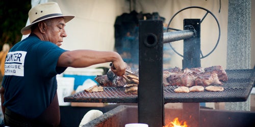 Cook grilling food at December Nights