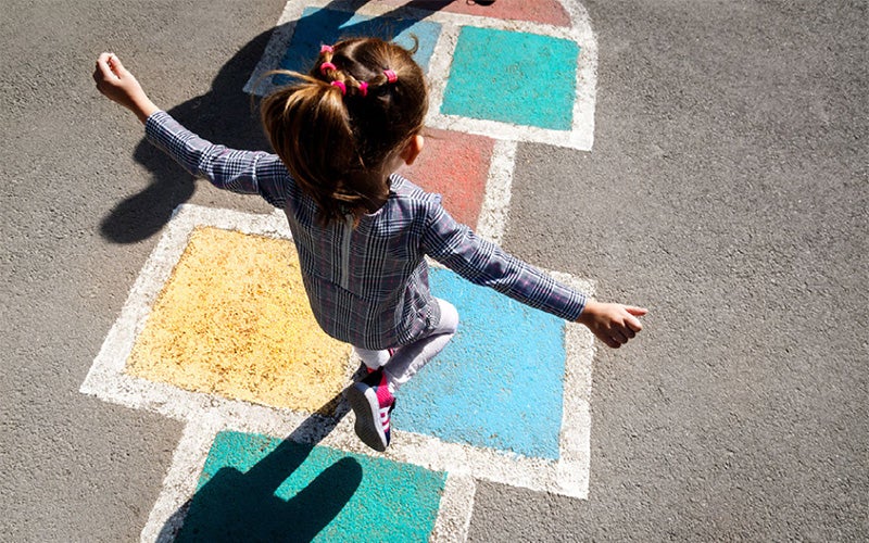 Child playing hopscotch