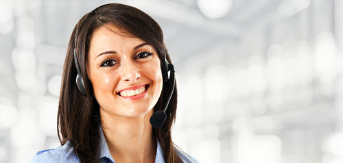 Customer representative with a headset smiling