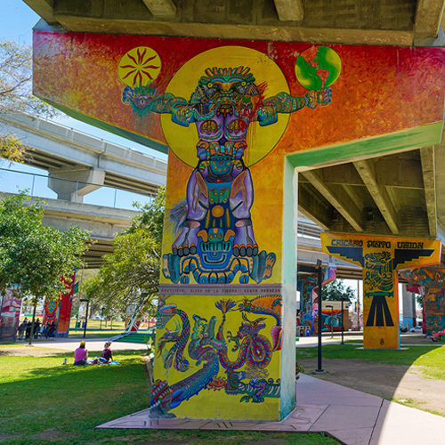 A mural painted on a bridge support at Chicano Park