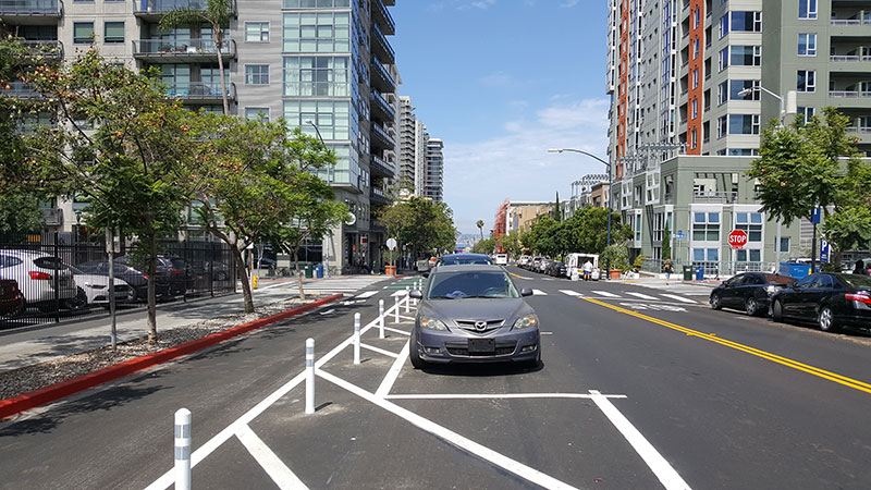 Downtown street with a protected bike lane