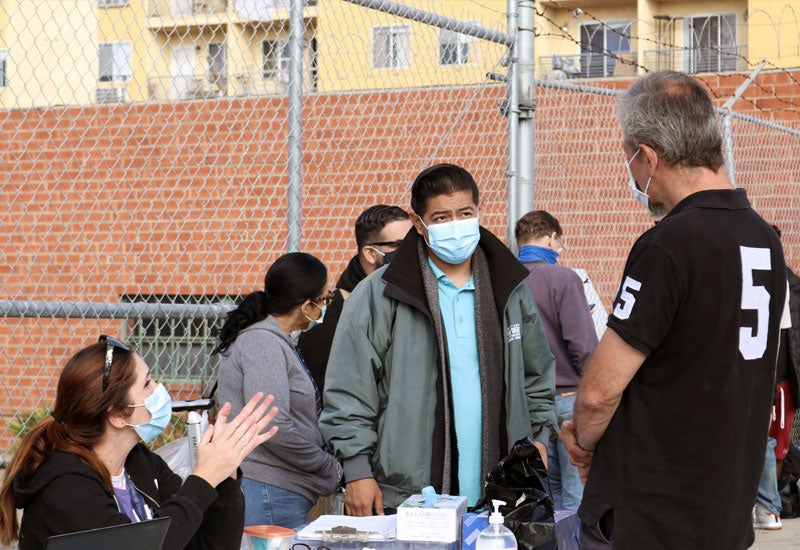 Man speaking to Family Reunification Programs staff members