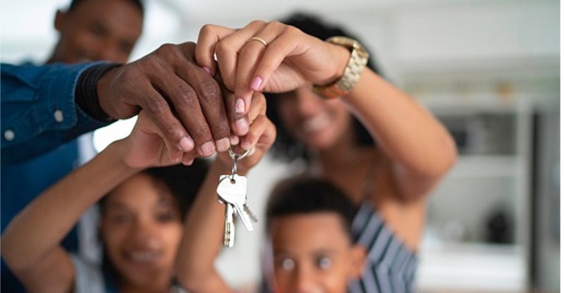 Family Holding Home Keys