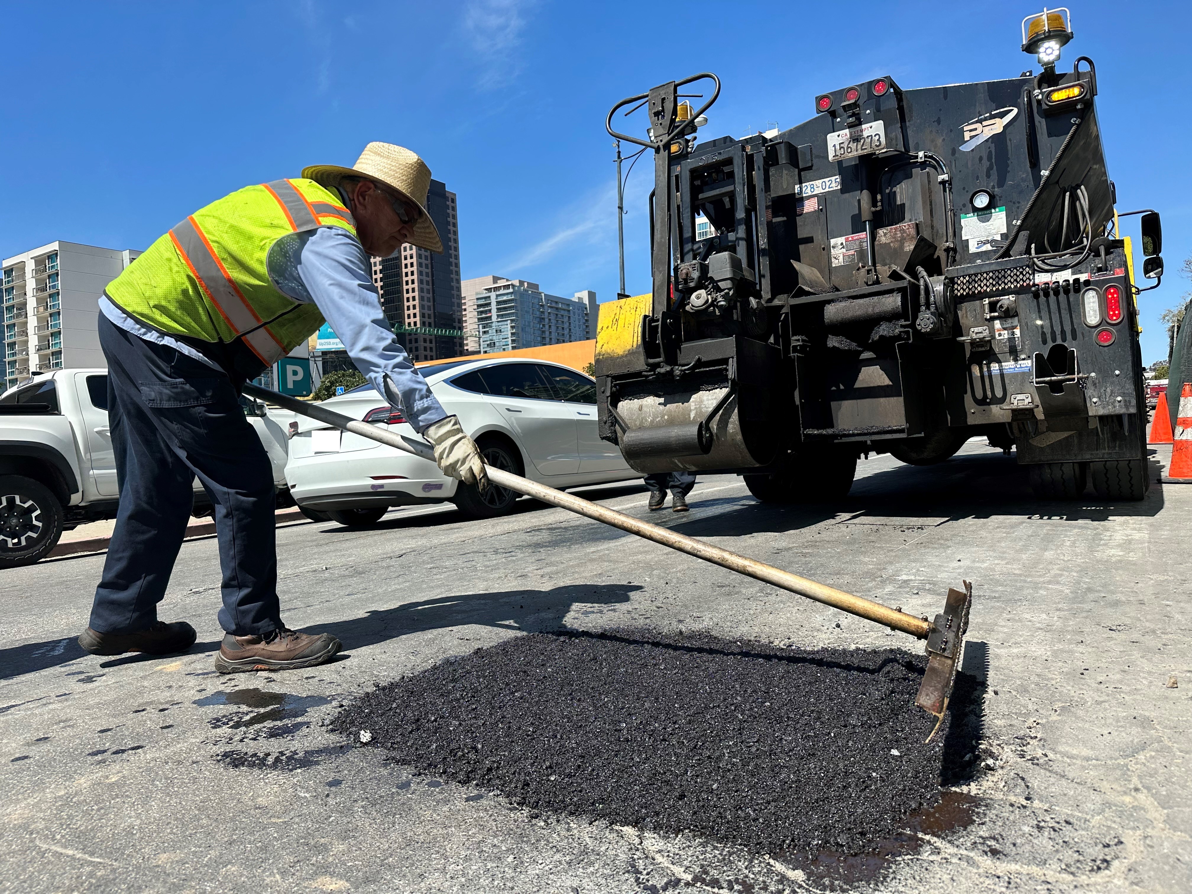 City worker fixing a pothole