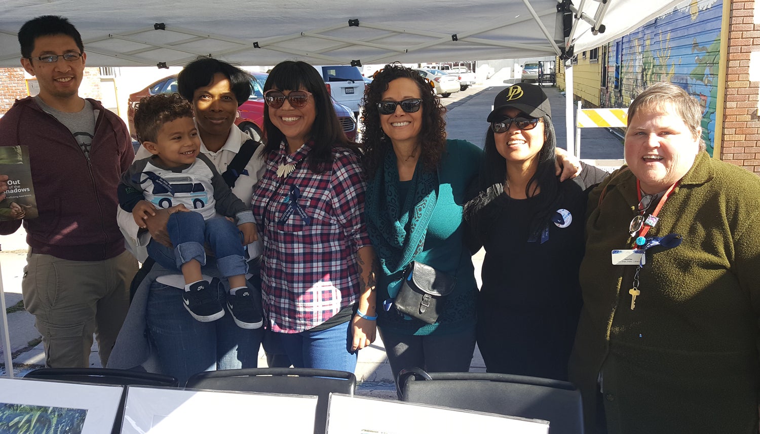 Photo of Library staff working the booth at the Freedom Now Fair.