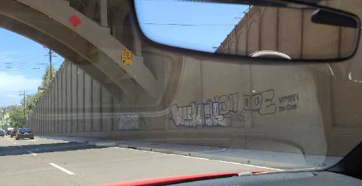 Graffiti on the Georgia Street Bridge ramp wall