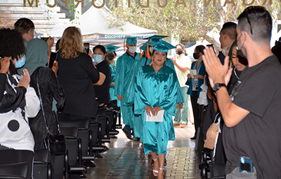 Graduates walking down aisle