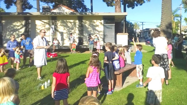 Children participating in a program at the Kensington-Normal Heights Library