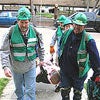 Photo of Team Members Taking a Victim to Medical Treatment