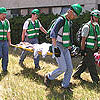 Photo of Team Members Carrying a Victim