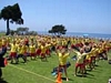 Children exercising with both hands raised up