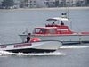 Two Lifeguard boats moving on water