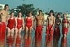 Eight people standing in water