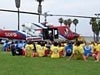 An officer talking to kids about the Fire-Rescue helicopter