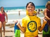 Picture of a girl in yellow shirt holding feather