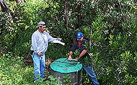 Photo of Workers Using GPS Unit