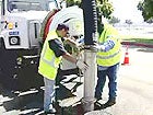 Photo of Two City Workers Cleaning Sewer Mains
