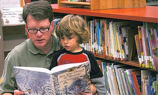 Man reading to child